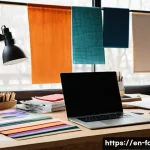 Home 19 패션디자인 스타트업 경험 공유 - A creative fashion designer’s studio featuring a large wooden table covered with colorful fabric swa...